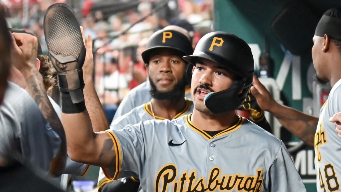 Nick Gonzales is greeted in the Pirates' dugout during a game in St. Louis in September.