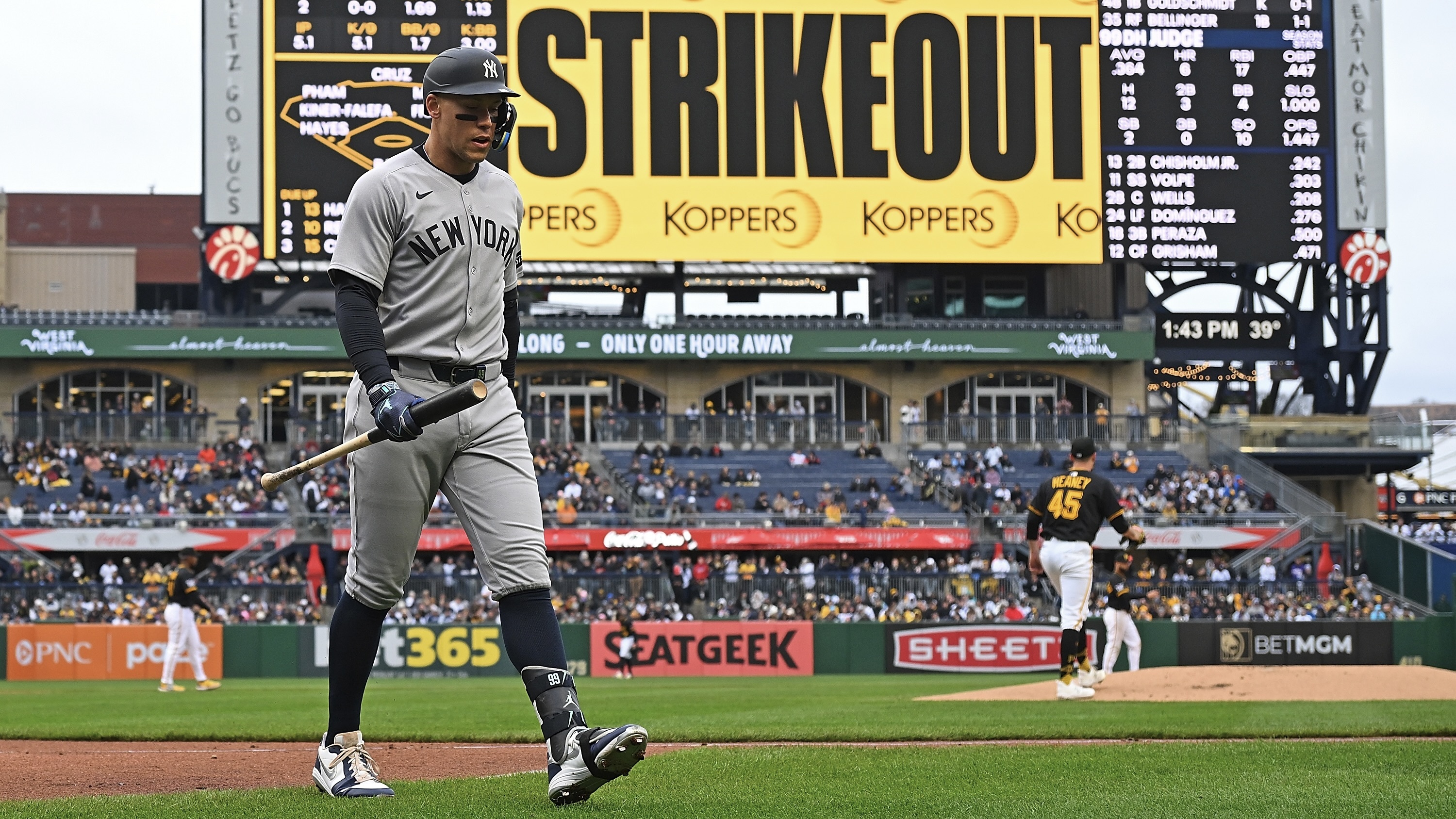 Aaron Judge heads to the Yankees' dugout after striking out against Andrew Heaney in the first inning.