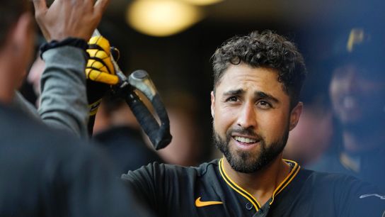 Alfonso Rivas is congratulated in the dugout after his three-run home run in the first inning.