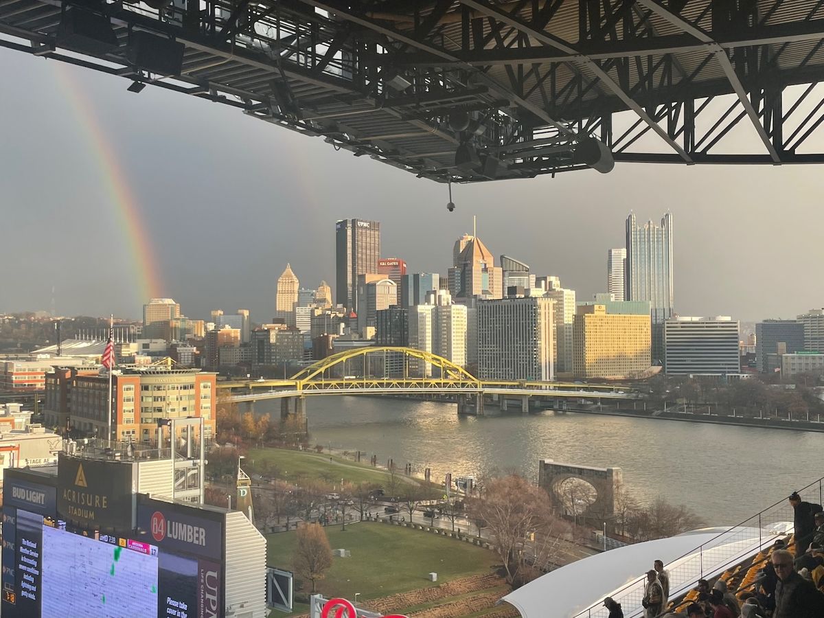 Rainbow appearing to the left edge of Downtown after the second of the two lightning delays Sunday.