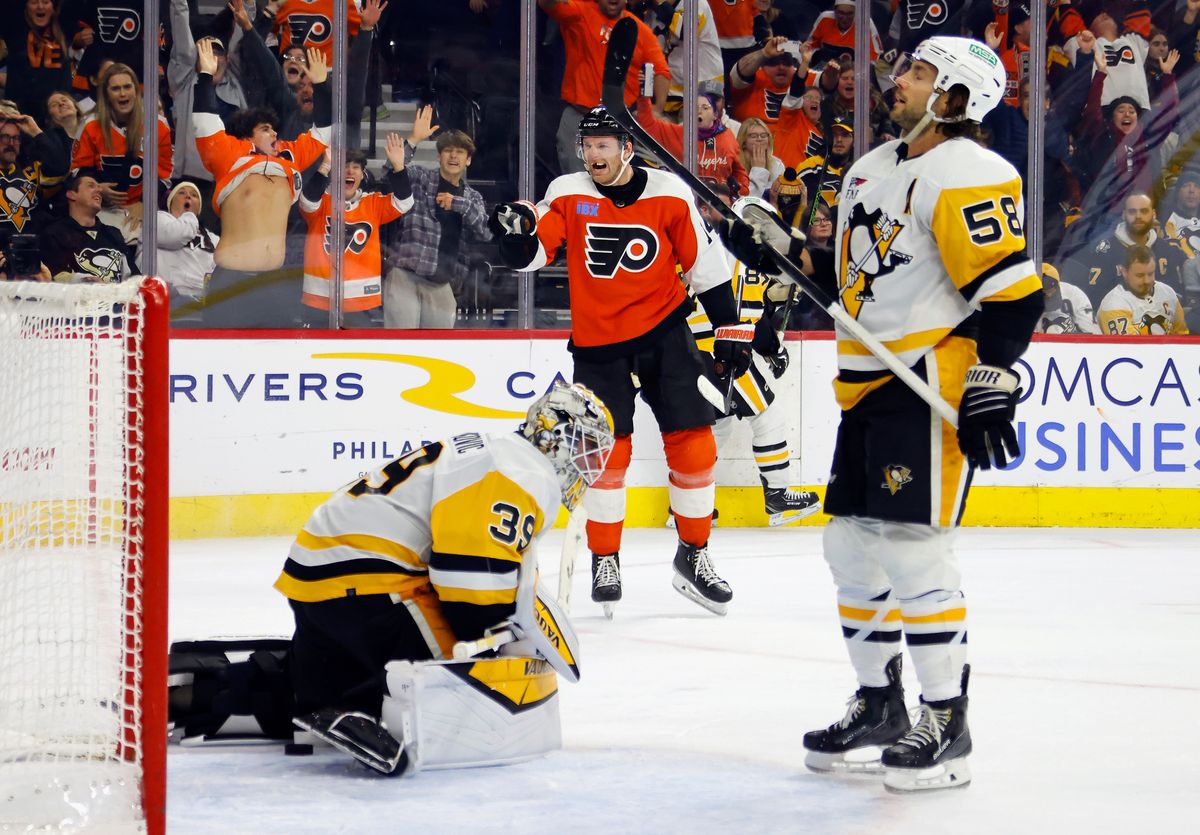 Alex Nedeljkovic and Kris Letang react to the Flyers' Sean Couturier scoring in overtime Monday night in Philadelphia.