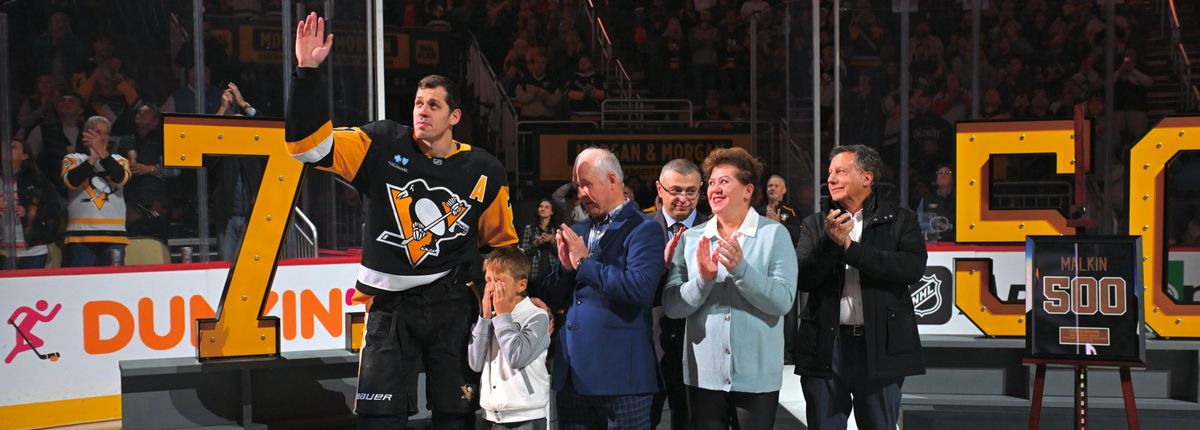 Evgeni, Nikita, Vladimir and Natalia Malkin, plus Tom Werner of Fenway Sports Group.