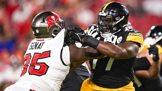 Broderick Jones blocks the Buccaneers' Deadrin Senat in the second quarter Friday night in Tampa, Fla.