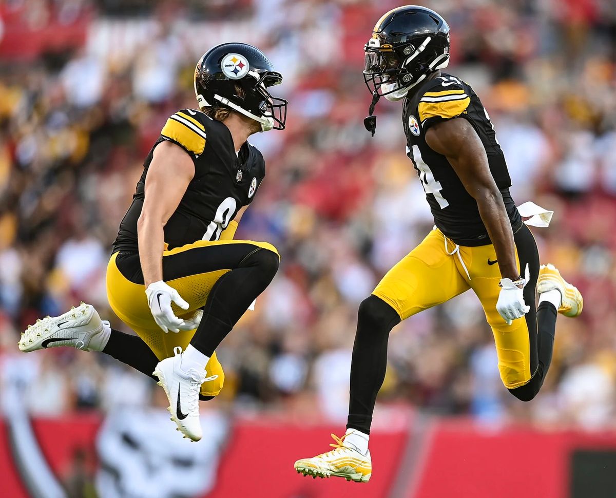 Kenny Pickett and George Pickens celebrate their 33-yard touchdown in the first quarter Friday night in Tampa, Fla.