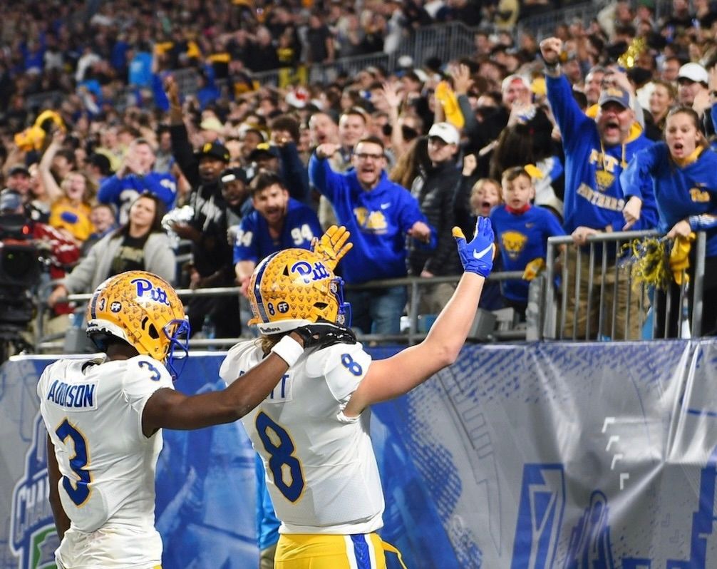 Jordan Addison and Kenny Pickett play to the Pitt fans Dec. 4, 2021, in Charlotte, N.C.