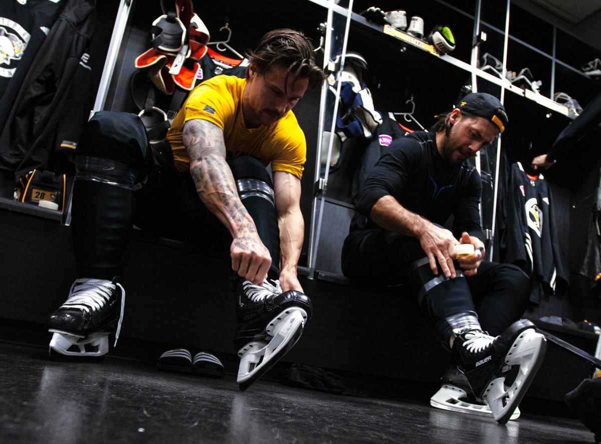 Erik Karlsson and Kris Letang lace up the skates Thursday in Los Angeles.