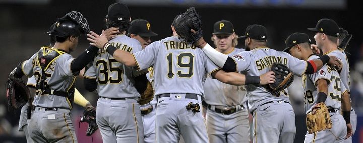 The Pirates celebrate after the final out Monday night in San Diego.