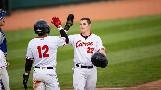 Henry Davis celebrates after scoring a run.