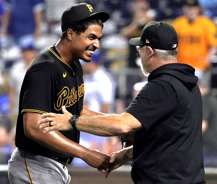 Johan Oviedo's congratulated by Derek Shelton after his shutout Monday night in Kansas City, Mo. 