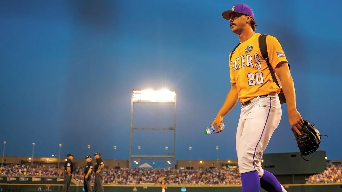 Paul Skenes walks onto the field in the College World Series.