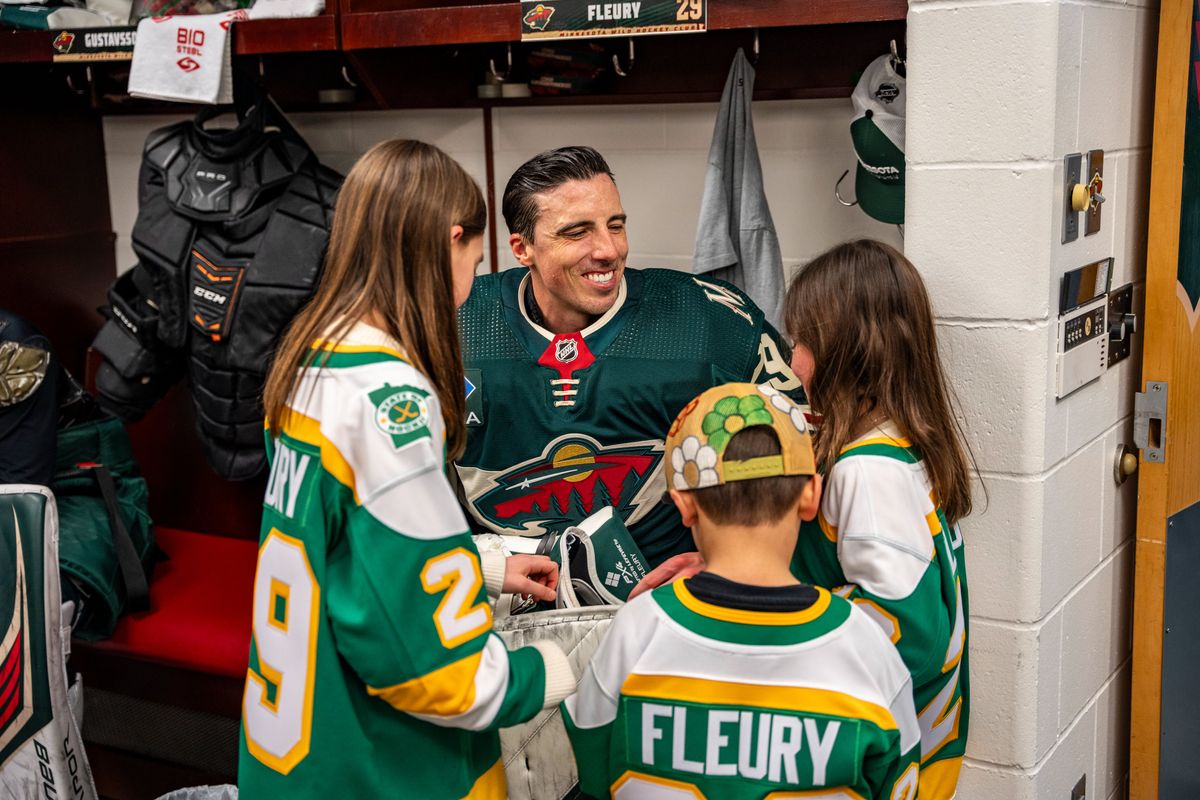 Marc-Andre Fleury with his children in the Wild's locker room before Friday's game.