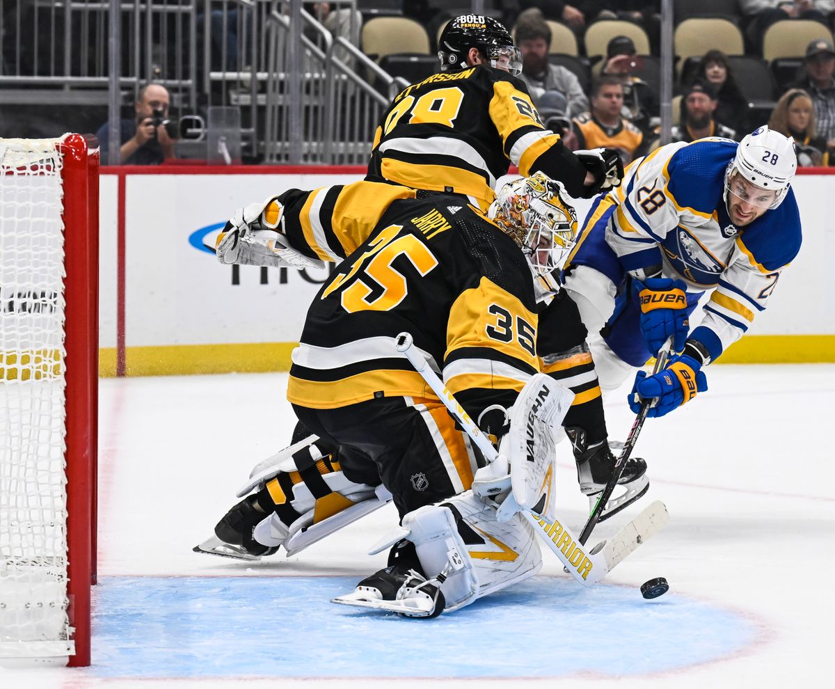 Tristan Jarry makes a save on Zemgus Girgensons Thursday at PPG Paints Arena