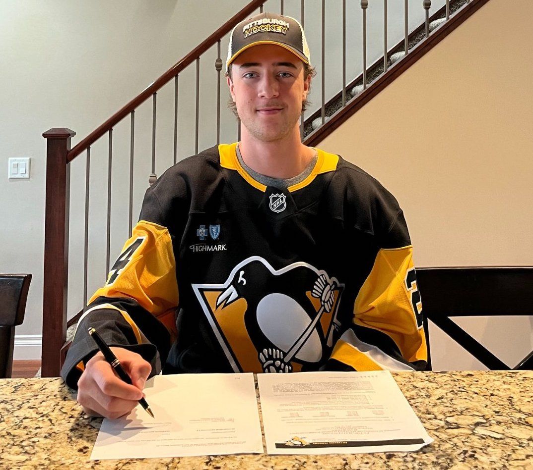 Harrison Brunicke signing his entry-level contract on Thursday.